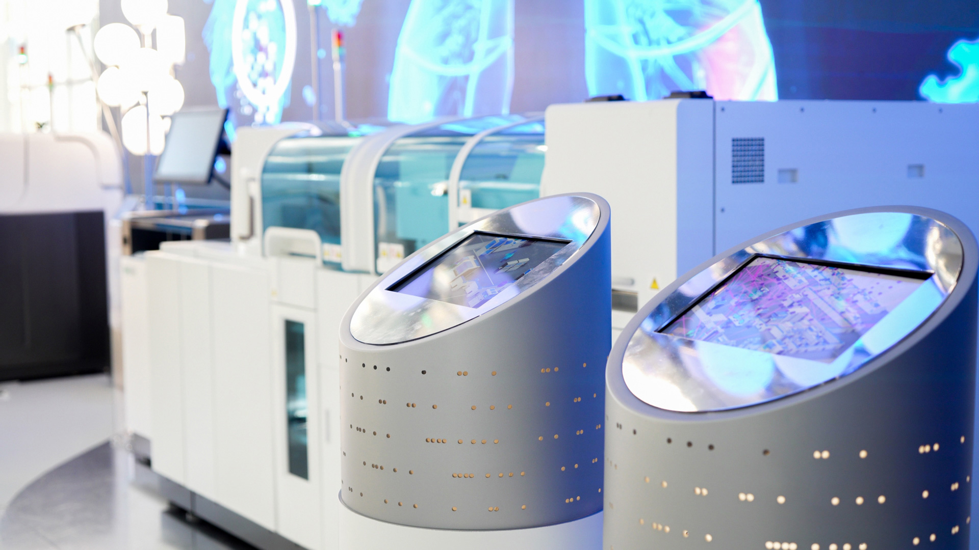 Close-up of interactive kiosks enabling visitors to explore diagnostics content hands-on.
