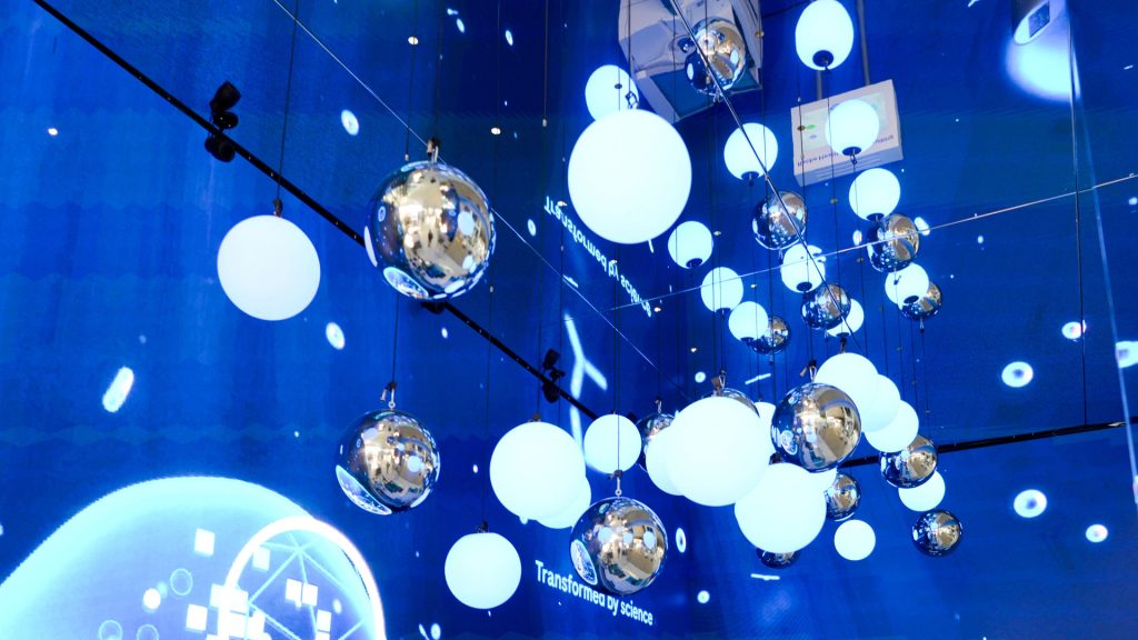 LED walls combined with suspended light sphere installation