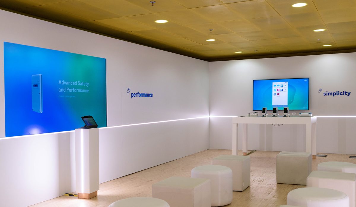 A clean, minimalist exhibition space for the cobas pulse designed for interactive demonstrations at the EuroMedLab Rome event.